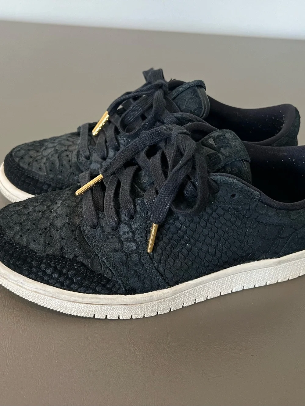 Jordan Women's Black Low-Top Sneakers with Gold Lace Aglets